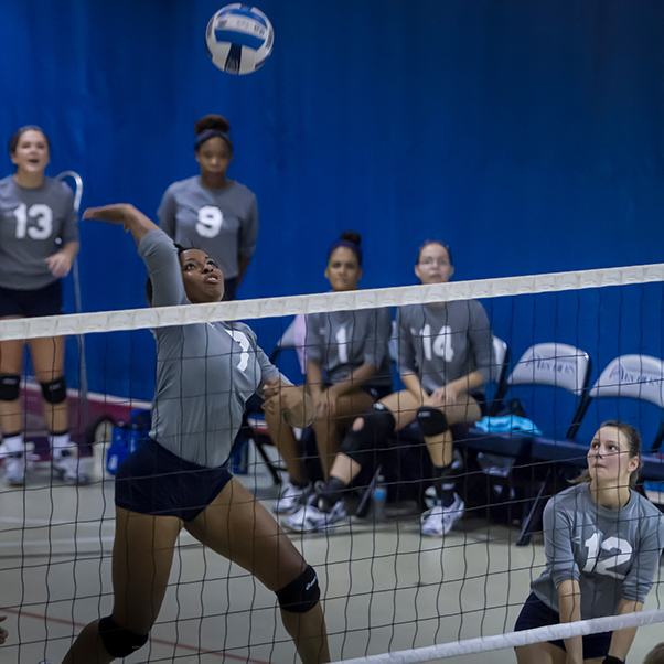 volleyball player is ready to spike ball