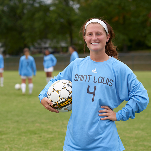 women's soccer player on field