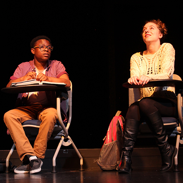 2 students sitting in class