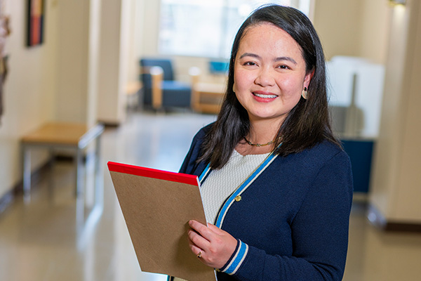 Employee holding notepad
