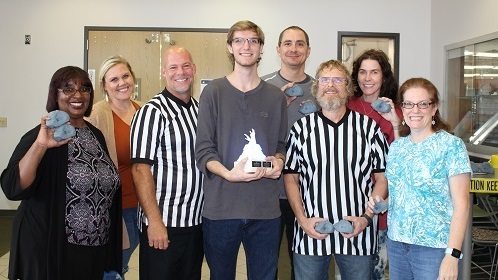 Ryan Fischer, center with trophy, is pictured with the Florissant Valley Wellness Committee.