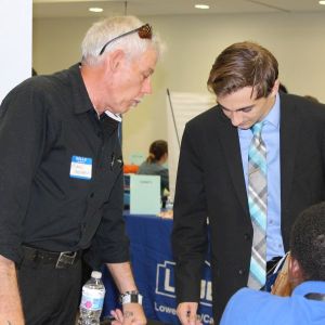 student talking to employer at career fair