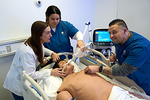 STLCC respiratory care students practicing on a dummy
