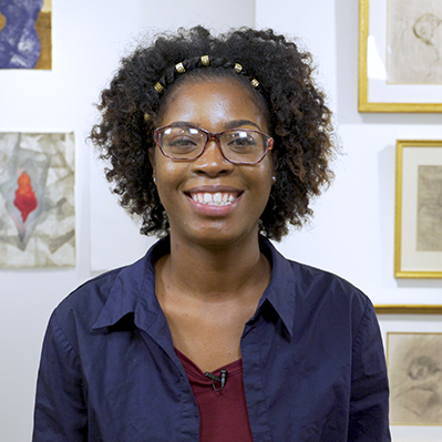 2019 student speaker janessa johnson in front of her artwork at florissant valley