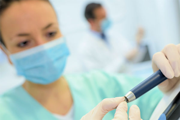 Student gaining experience as a sterile processing technician in hospital training setting