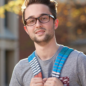 STLCC student with backpack on campus