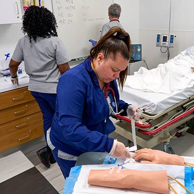 Bellwether Finalist for Health Care Plan Nursing students practice on mannequins