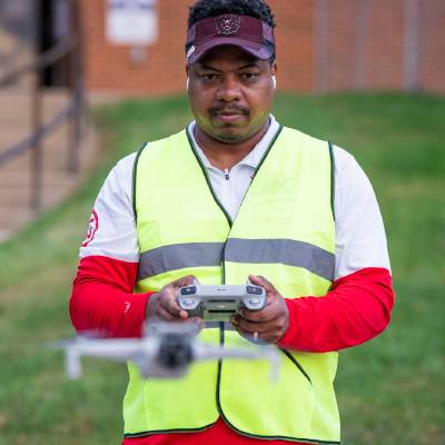 Student flying drone at Florissant Valley Student flying drone at Florissant Valley