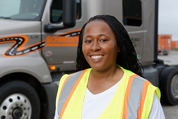Student in front of semi-truck